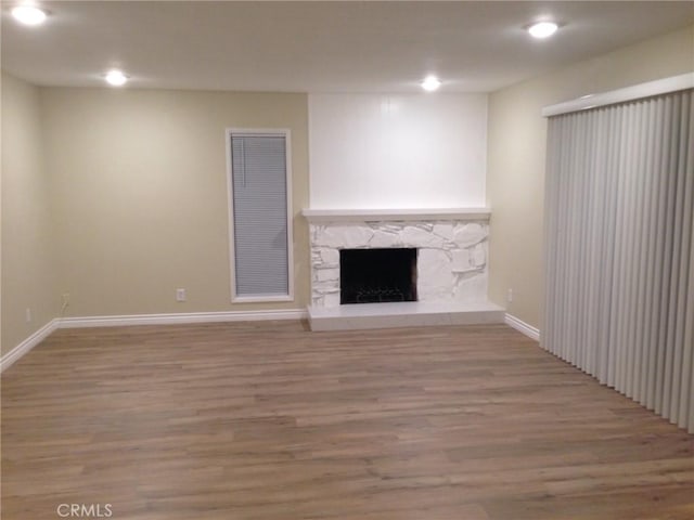 2652 College Ln, La Verne, CA 91750 - unfurnished living room with wood finished floors, baseboards, recessed lighting, and a fireplace