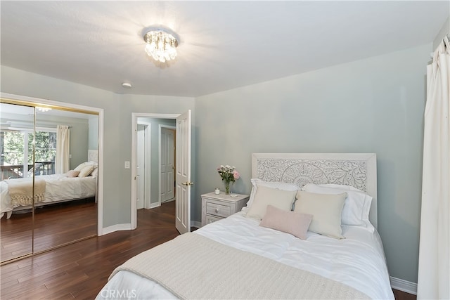 405 Terrace Rd, Lake Arrowhead, CA 92352 - bedroom featuring dark wood-style floors, baseboards, a chandelier, and a closet