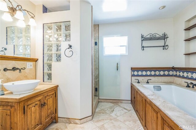 20005 Anza Ave, Torrance, CA 90503 - bathroom featuring a shower stall, a garden tub, vanity, and decorative backsplash