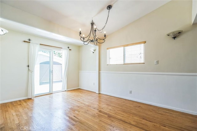 20005 Anza Ave, Torrance, CA 90503 - empty room featuring a chandelier, wood finished floors, and vaulted ceiling