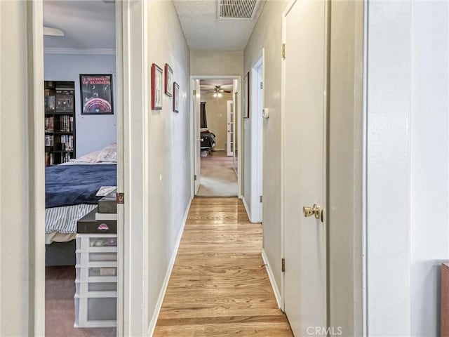 5436 Bonfair Ave, Lakewood, CA 90712 - corridor with light wood-style flooring, baseboards, and ornamental molding