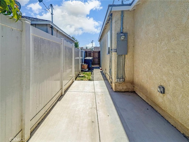 5436 Bonfair Ave, Lakewood, CA 90712 - view of side of property featuring a fenced backyard, stucco siding, and a patio