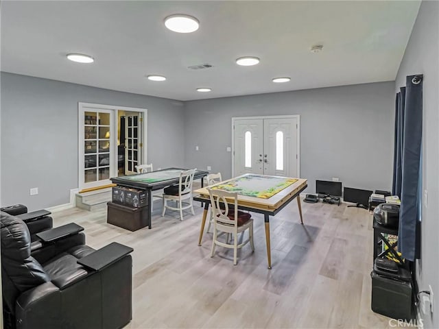 5436 Bonfair Ave, Lakewood, CA 90712 - playroom featuring french doors, light wood finished floors, and baseboards