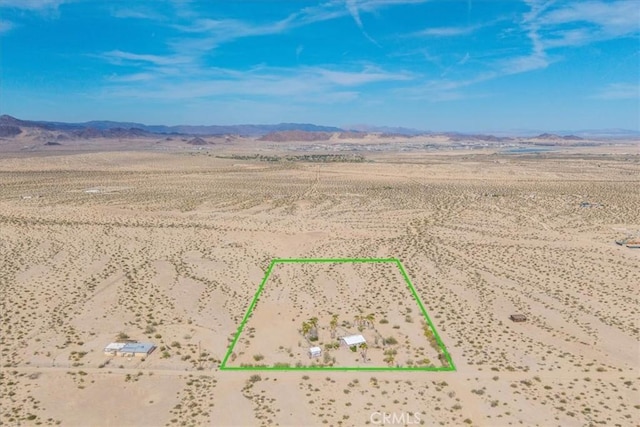 380 Mack Ln Unit 29, Palms, CA 92277 - view of rural area with a desert landscape, a mountain backdrop, and property parcel outlined
