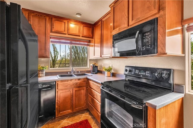380 Mack Ln Unit 29, Palms, CA 92277 - kitchen featuring black appliances, a sink, and light countertops