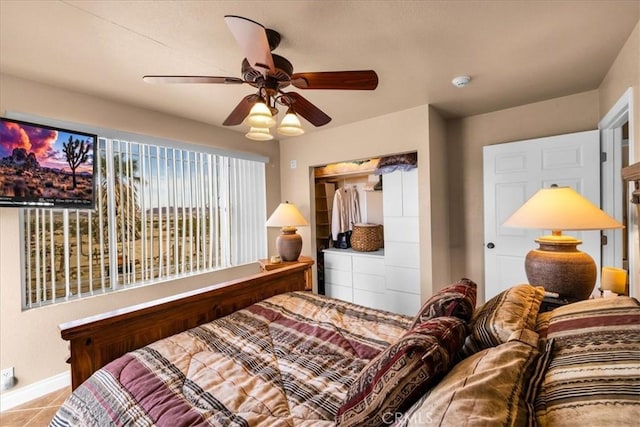 380 Mack Ln Unit 29, Palms, CA 92277 - bedroom with baseboards, a closet, a ceiling fan, and tile patterned floors