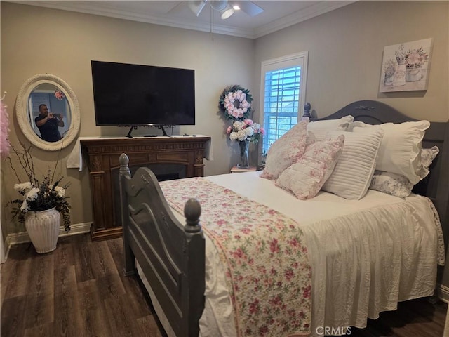 25687 Red Hawk Rd, Corona, CA 92883 - bedroom with dark wood-type flooring, ornamental molding, and ceiling fan