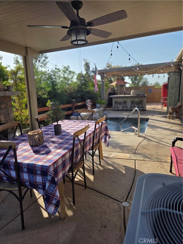 25687 Red Hawk Rd, Corona, CA 92883 - view of patio with ceiling fan and an outdoor kitchen