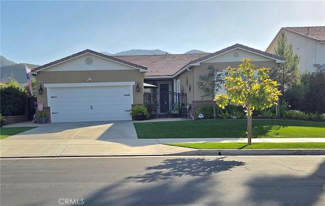 25687 Red Hawk Rd, Corona, CA 92883 - ranch-style home featuring an attached garage, driveway, stucco siding, and a front yard