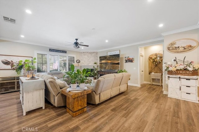 25687 Red Hawk Rd, Corona, CA 92883 - living area with a ceiling fan, wood finished floors, recessed lighting, and crown molding