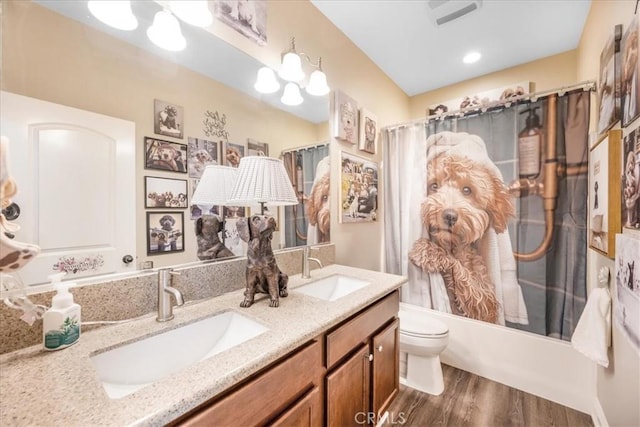 25687 Red Hawk Rd, Corona, CA 92883 - full bathroom featuring wood finished floors, double vanity, and shower / tub combo with curtain