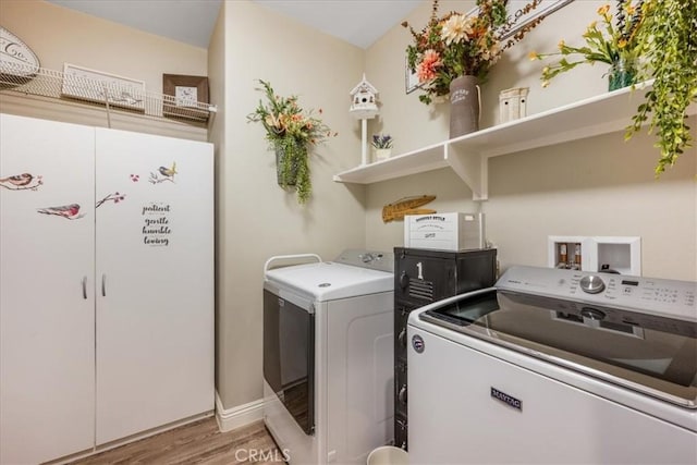 25687 Red Hawk Rd, Corona, CA 92883 - laundry room with washer and clothes dryer and light wood-style floors