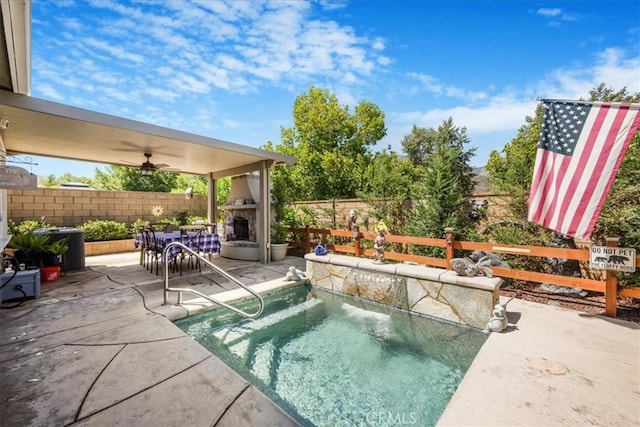 25687 Red Hawk Rd, Corona, CA 92883 - view of pool featuring an outdoor stone fireplace, a fenced backyard, a patio area, and ceiling fan