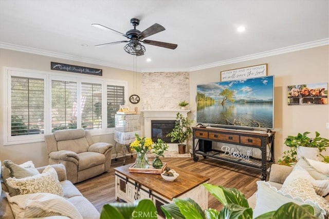 25687 Red Hawk Rd, Corona, CA 92883 - living area with crown molding, wood finished floors, a ceiling fan, a glass covered fireplace, and recessed lighting