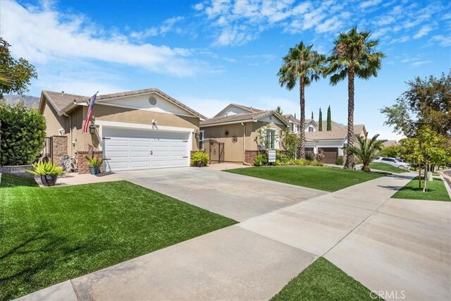 25687 Red Hawk Rd, Corona, CA 92883 - ranch-style house with driveway, stucco siding, a front lawn, and an attached garage