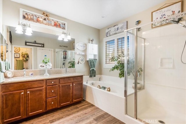25687 Red Hawk Rd, Corona, CA 92883 - bathroom featuring a stall shower, double vanity, a bath, wood finished floors, and a chandelier