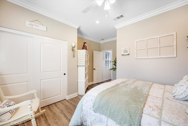 25687 Red Hawk Rd, Corona, CA 92883 - bedroom with crown molding, wood finished floors, a ceiling fan, a closet, and recessed lighting