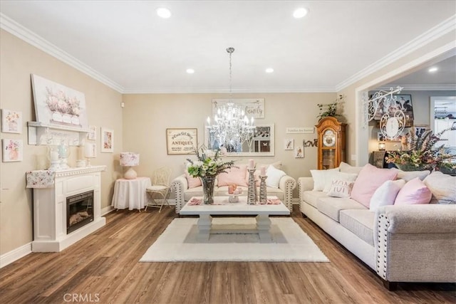 25687 Red Hawk Rd, Corona, CA 92883 - living room featuring crown molding, wood finished floors, a chandelier, recessed lighting, and a glass covered fireplace