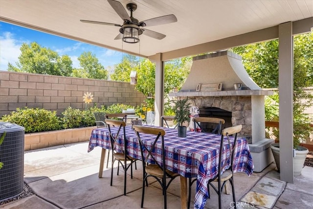 25687 Red Hawk Rd, Corona, CA 92883 - view of patio with an outdoor stone fireplace, outdoor dining space, and ceiling fan