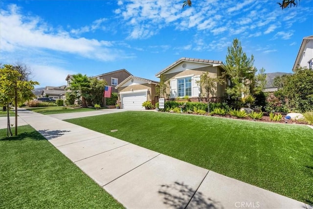 25687 Red Hawk Rd, Corona, CA 92883 - view of front of house featuring a front yard, driveway, an attached garage, and stucco siding