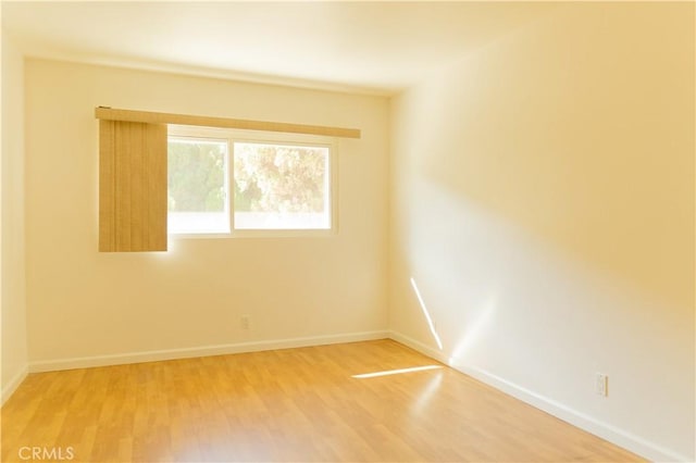 919 E Ln Palma Dr Unit 4, Inglewood, CA 90301 - spare room with light wood-style flooring and baseboards