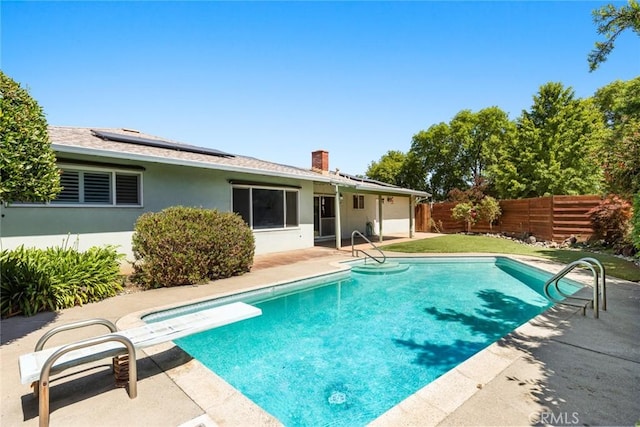 7 Pinecrest Cir, Chico, CA 95926 - view of swimming pool with a patio, a fenced backyard, and a diving board