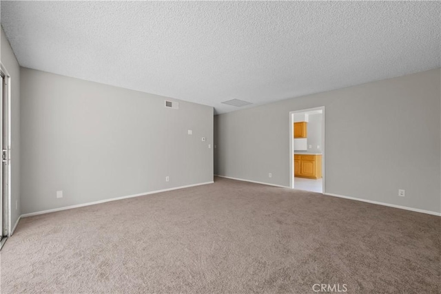 26111 Abdale St, Newhall, CA 91321 - carpeted empty room featuring a textured ceiling and baseboards