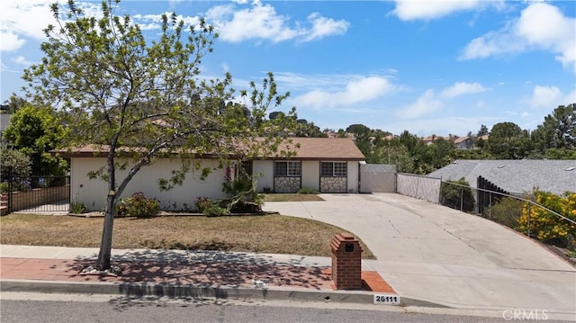 26111 Abdale St, Newhall, CA 91321 - ranch-style home featuring driveway, a gate, and stucco siding
