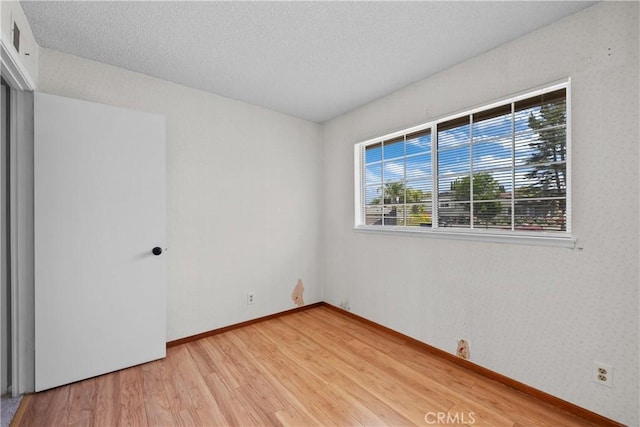 26111 Abdale St, Newhall, CA 91321 - unfurnished bedroom featuring light wood-style floors and baseboards