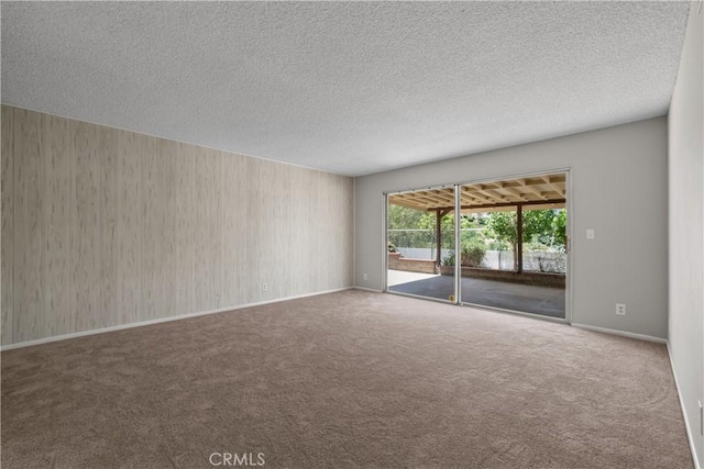 26111 Abdale St, Newhall, CA 91321 - carpeted spare room with a textured ceiling and baseboards
