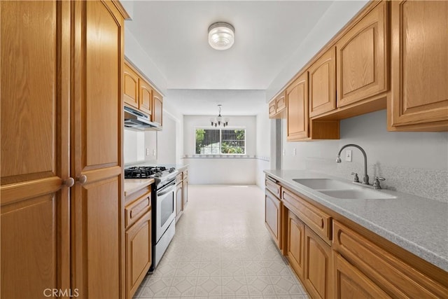 26111 Abdale St, Newhall, CA 91321 - kitchen featuring gas stove, a sink, a chandelier, light countertops, and under cabinet range hood