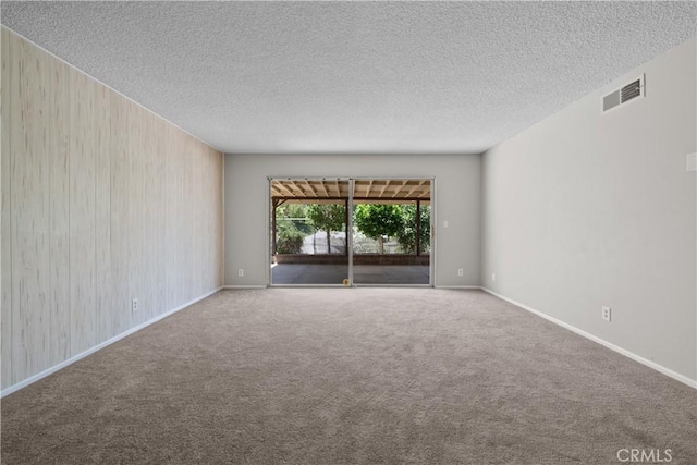 26111 Abdale St, Newhall, CA 91321 - spare room featuring a textured ceiling, carpet floors, and baseboards
