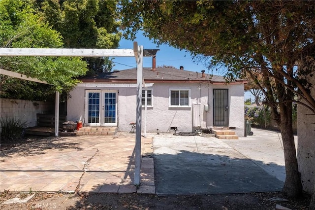 4024 W 166th St, Lawndale, CA 90260 - back of house with entry steps, french doors, stucco siding, and a patio
