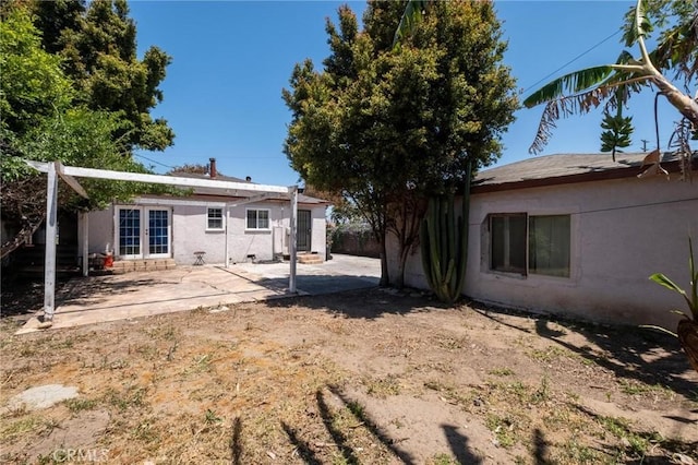 4024 W 166th St, Lawndale, CA 90260 - rear view of house featuring french doors, stucco siding, a patio, and entry steps