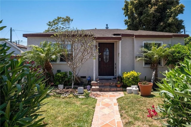 4024 W 166th St, Lawndale, CA 90260 - entrance to property featuring stucco siding and a lawn