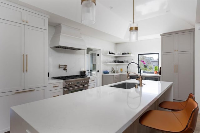 3030 Ibsen, Point Loma, CA 92106 - kitchen with custom range hood, high end range, a sink, and light countertops