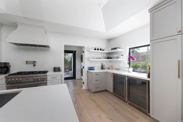 3030 Ibsen, Point Loma, CA 92106 - kitchen with wine cooler, high end range, custom exhaust hood, and estacked washer and dryer