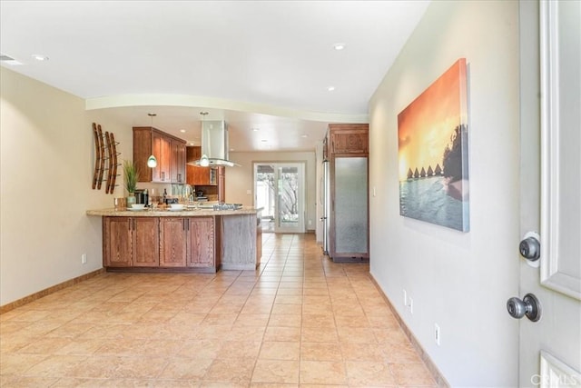 1256 Bostonia St Unit B, El Cajon, CA 92021 - kitchen featuring a peninsula, brown cabinets, island range hood, baseboards, and hanging light fixtures