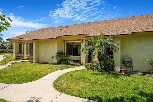 1256 Bostonia St Unit B, El Cajon, CA 92021 - rear view of property featuring stucco siding, a yard, and a shingled roof