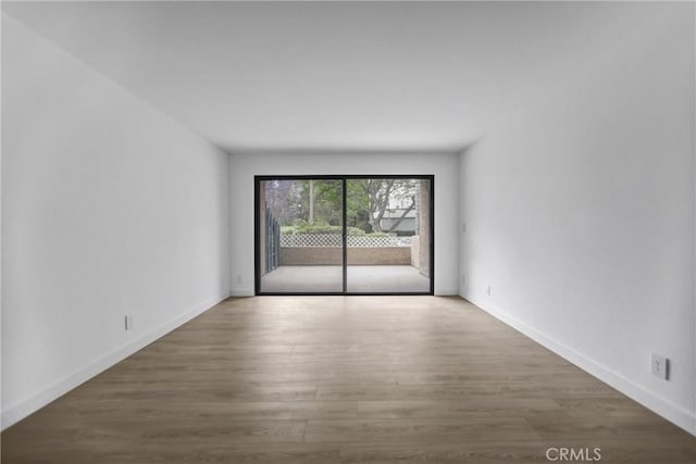 4499 Via Marisol Unit 105A, Los Angeles, CA 90042 - empty room featuring wood finished floors and baseboards