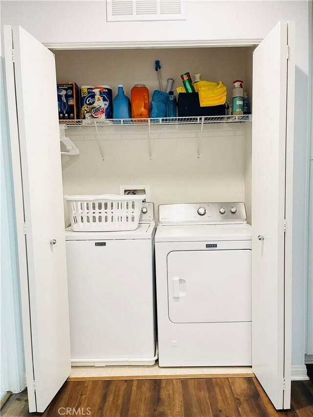14120 W Willow Ln, Van Nuys, CA 91405 - laundry room with separate washer and dryer and wood finished floors