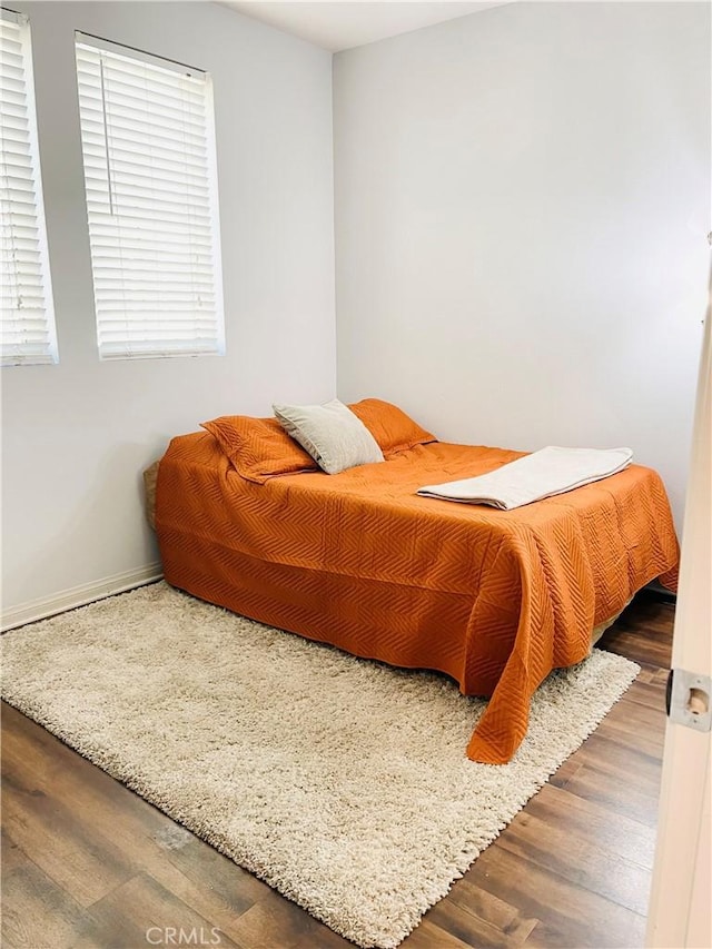 14120 W Willow Ln, Van Nuys, CA 91405 - bedroom featuring wood finished floors and baseboards