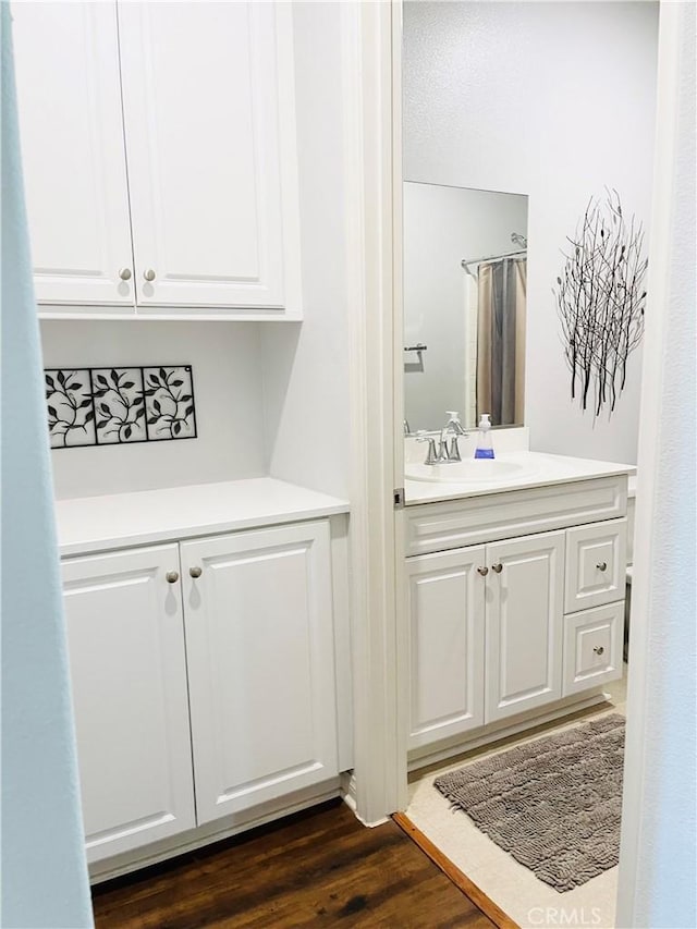 14120 W Willow Ln, Van Nuys, CA 91405 - bathroom featuring vanity and wood finished floors