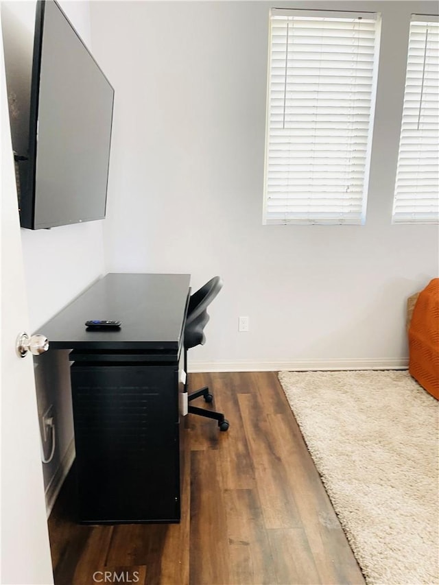 14120 W Willow Ln, Van Nuys, CA 91405 - home office with dark wood-type flooring and baseboards
