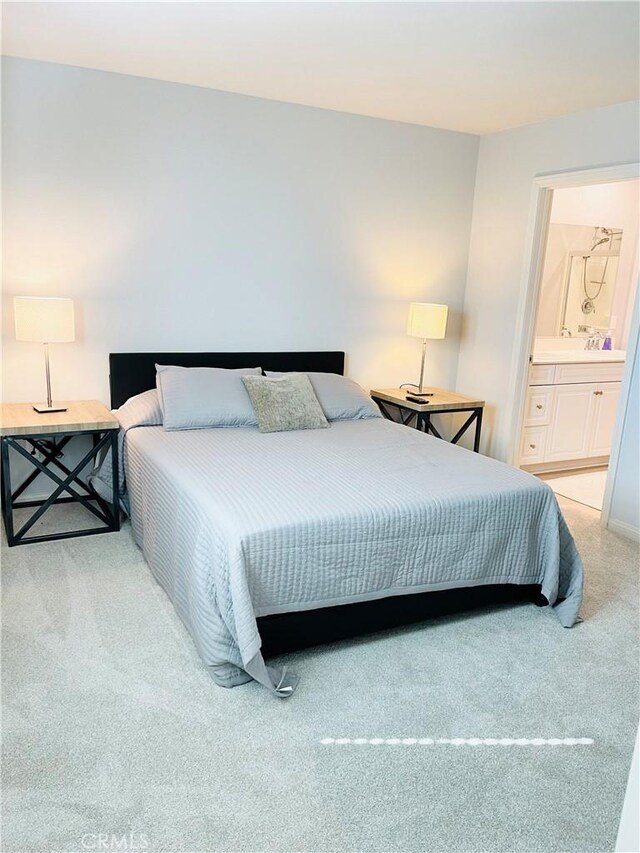 14120 W Willow Ln, Van Nuys, CA 91405 - bedroom with light colored carpet and connected bathroom