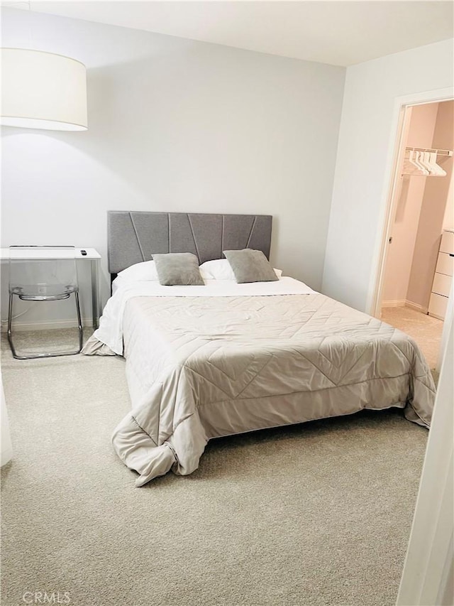 14120 W Willow Ln, Van Nuys, CA 91405 - bedroom with carpet floors and a walk in closet