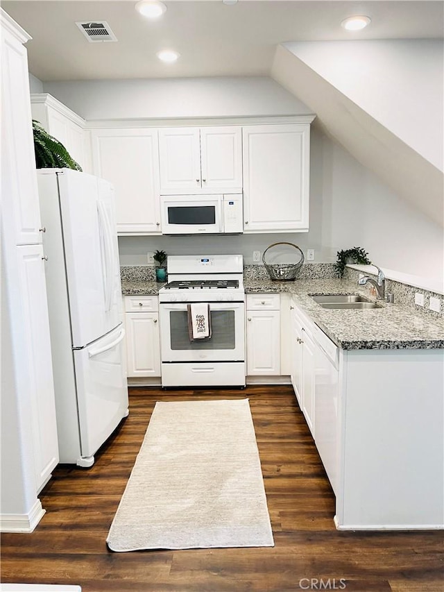 14120 W Willow Ln, Van Nuys, CA 91405 - kitchen featuring white appliances, recessed lighting, white cabinetry, light stone counters, and dark wood finished floors