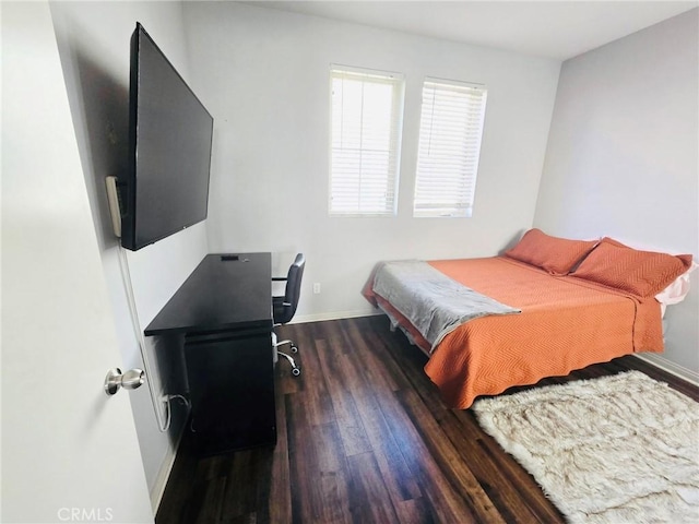 14120 W Willow Ln, Van Nuys, CA 91405 - bedroom featuring wood finished floors and baseboards