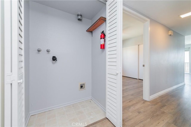 2244 Molino Ave, Signal Hill, CA 90755 - washroom with hookup for an electric dryer, baseboards, and light wood-style floors