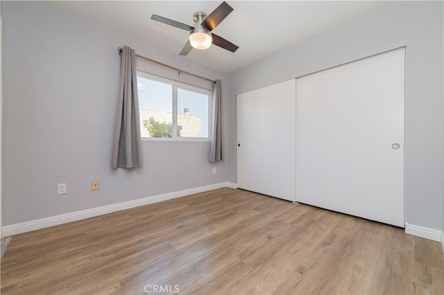 2244 Molino Ave, Signal Hill, CA 90755 - unfurnished bedroom with light wood-type flooring, a closet, baseboards, and a ceiling fan
